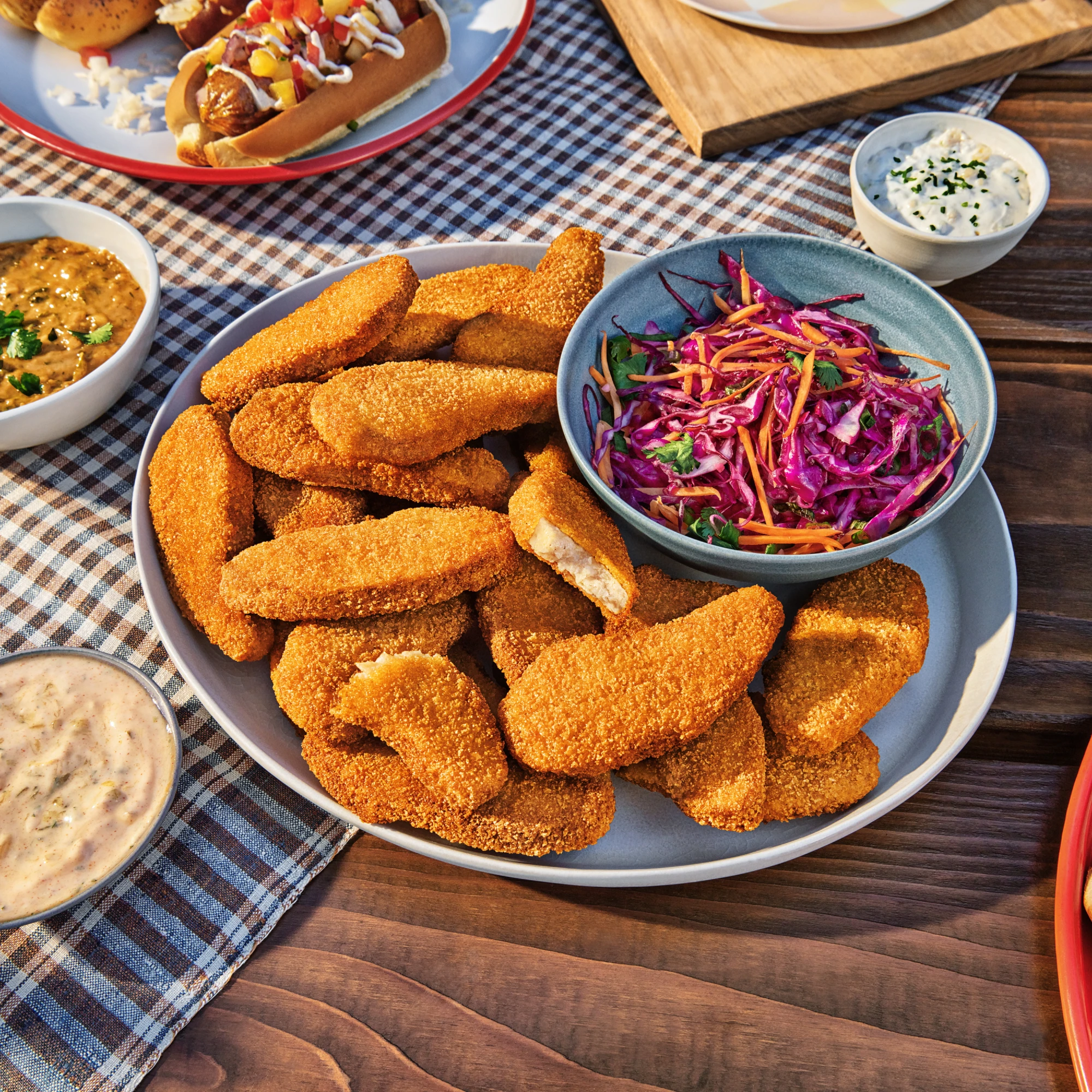Impossible Chicken Tenders plated with slaw