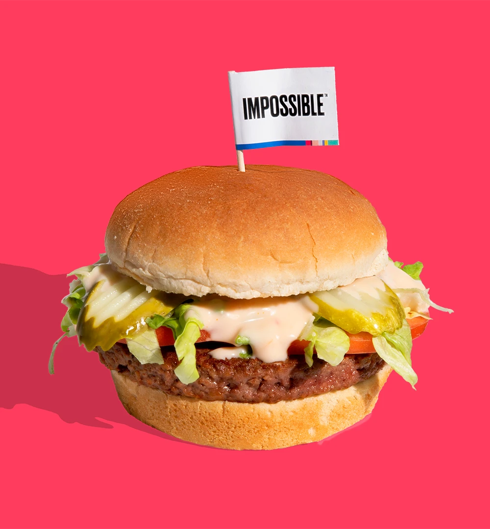 The Impossible™ Burger aka "The I.B." - seared ¼ lb Impossible Burger patty, shredded lettuce, fresh tomato, dill pickle chips, and I.B. sauce