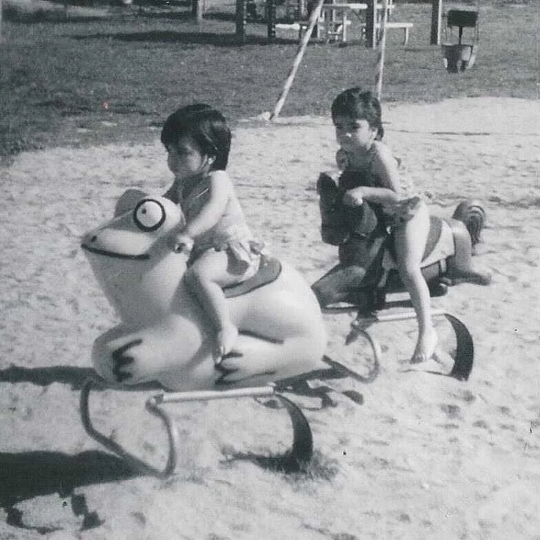 Edith Villanueva advocating for full inclusion and support for our LGBTQ+ Youth is pivotal thumbnail - picture of two young girls on a playground black and white