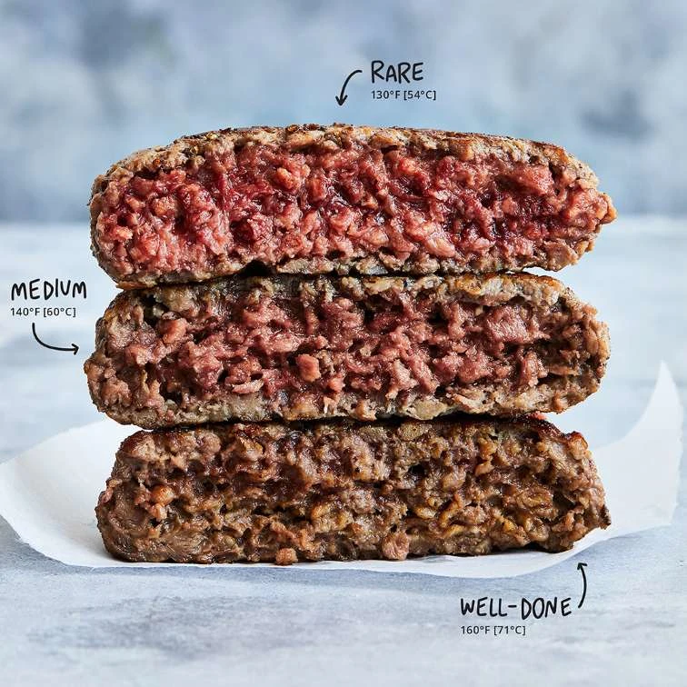 Three Impossible™ Burger patties with various cooking temperatures