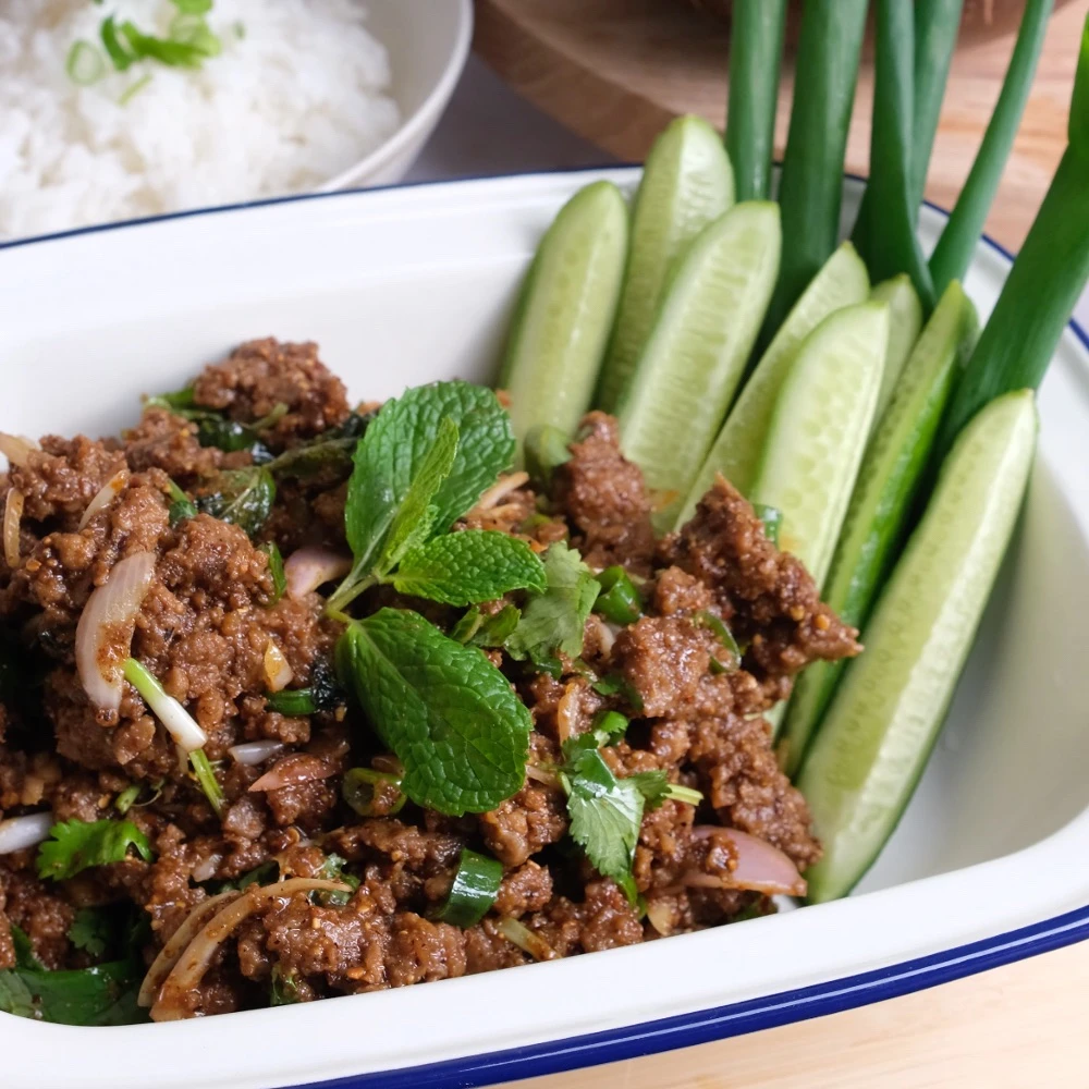 Tasty Impossible™ Beef Thai Larb salad with fresh mint and cucumber spears. 