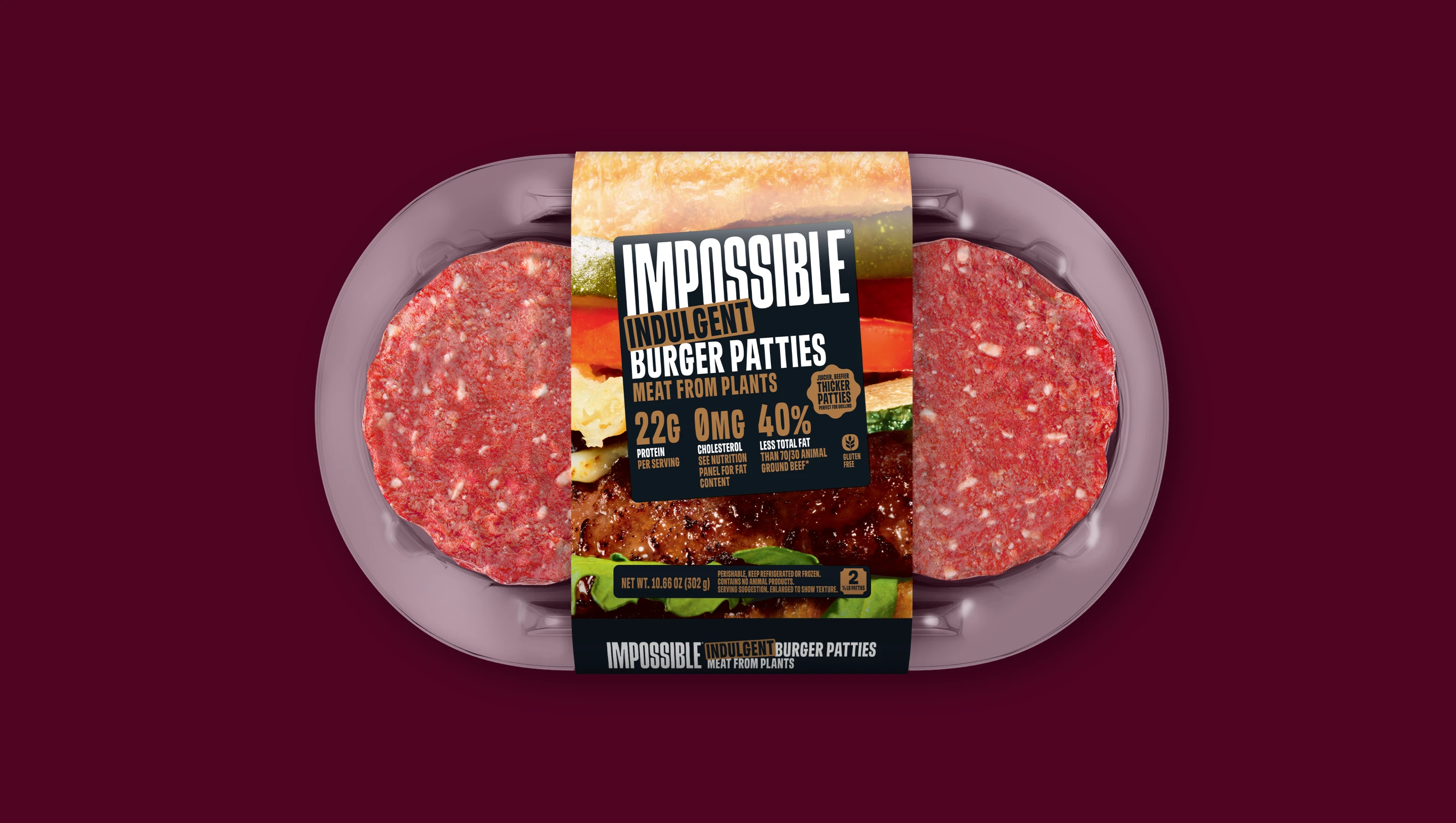 Front of pack of Impossible Indulgent Beef Patties from plants on a dark background.