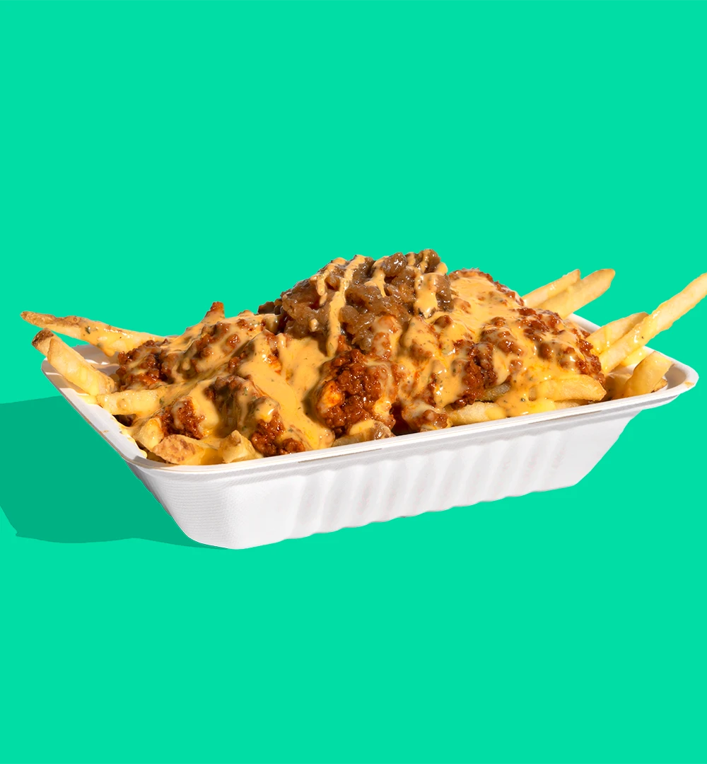 The Shop Chili Cheese Fries - Impossible Chili & plant-based cheese whiz smothered fries w/ chipotle-lime crema (one size)