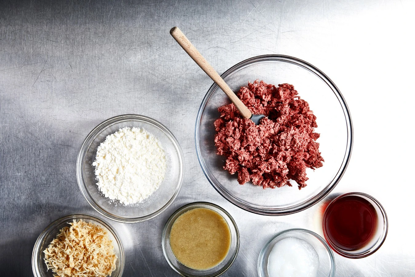 Table with Impossible™ Burger and ingredients 