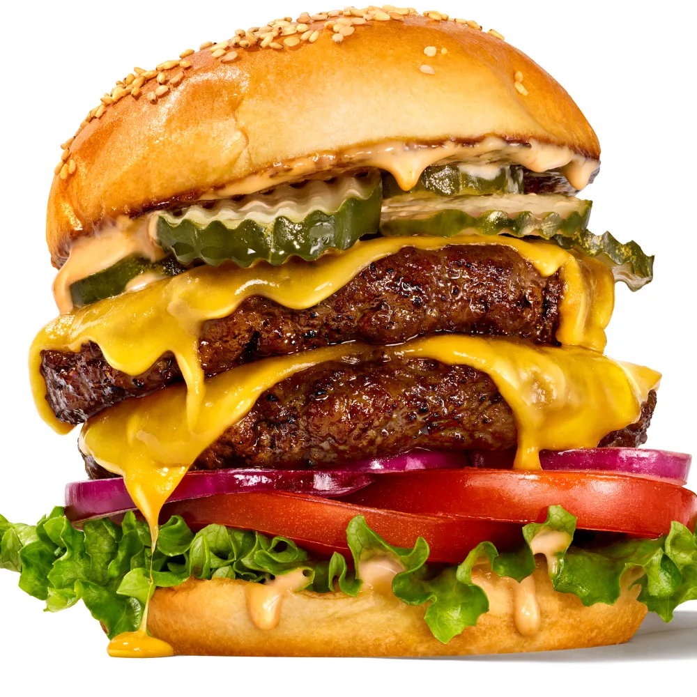 Double-stacked cheeseburger featuring Impossible Burger patties.