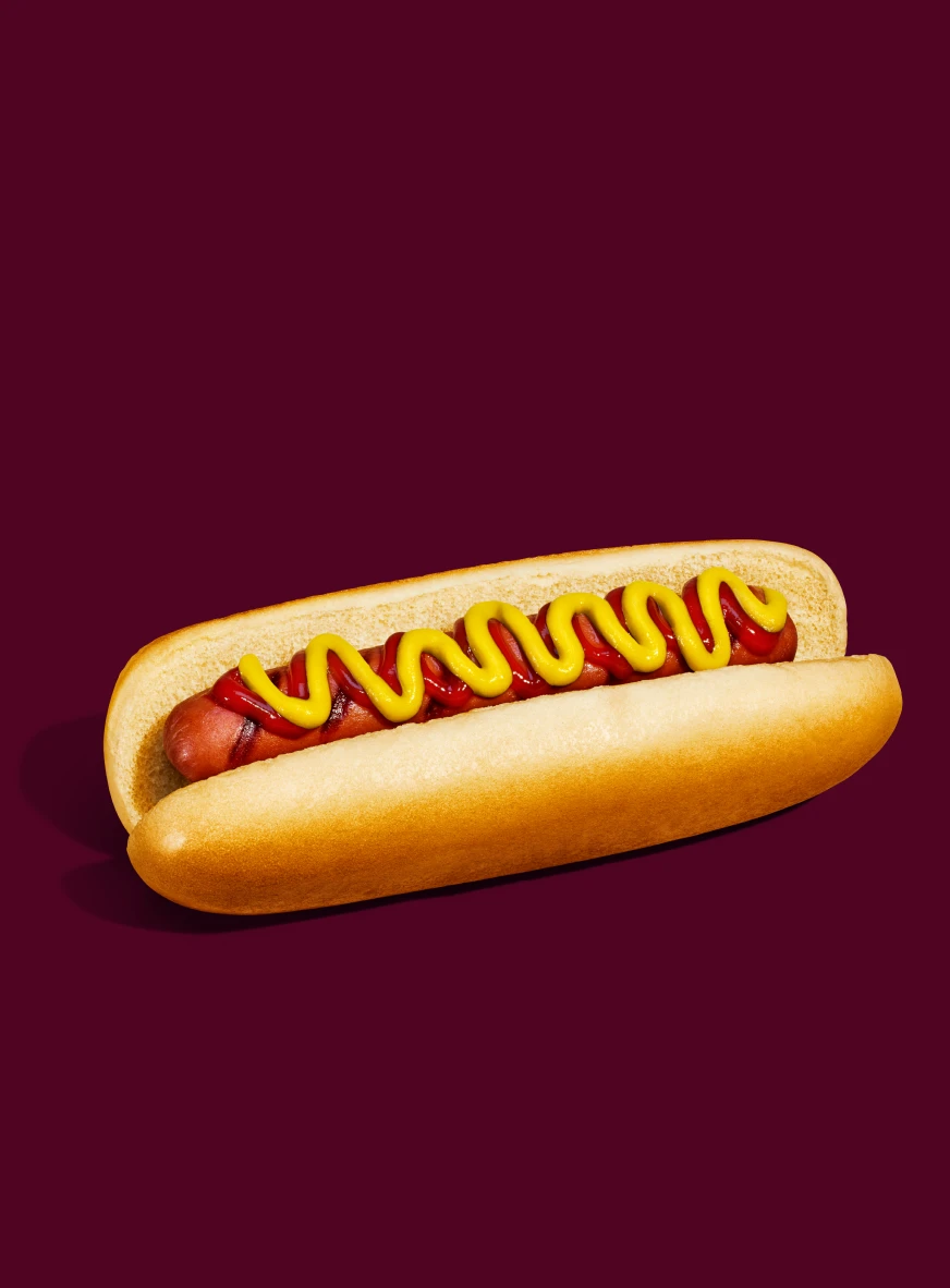 Impossible Hot Dog for foodservice showcased within a hot dog bun