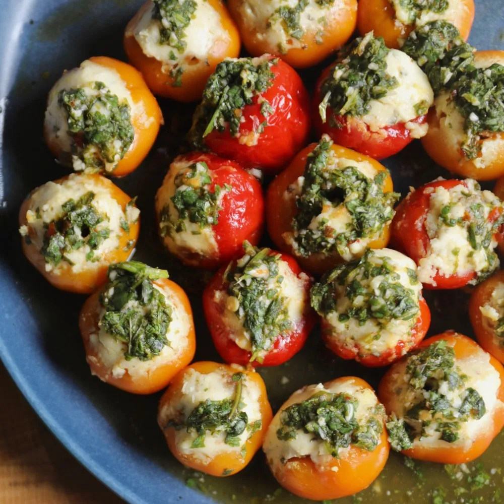 Small red and yellow piquanté peppers stuffed with Impossible Sausage Made From Plants, topped with Gournay cheese and topped with cilantro mint chutney. 