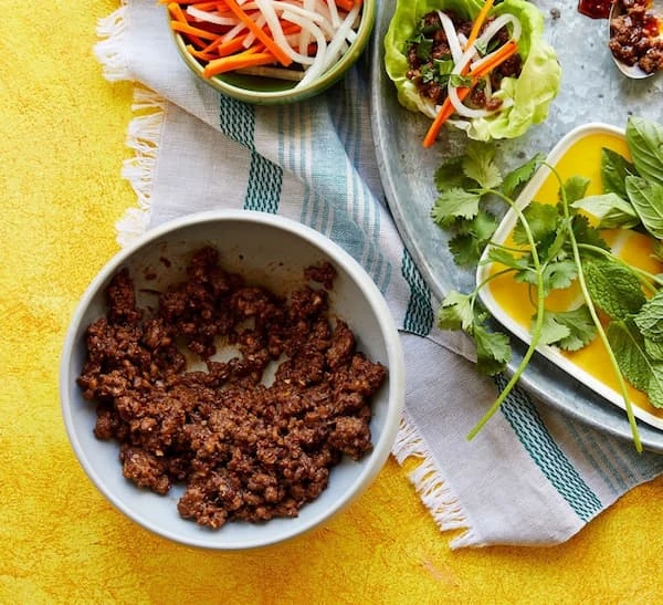 Impossible Larb next to cilantro