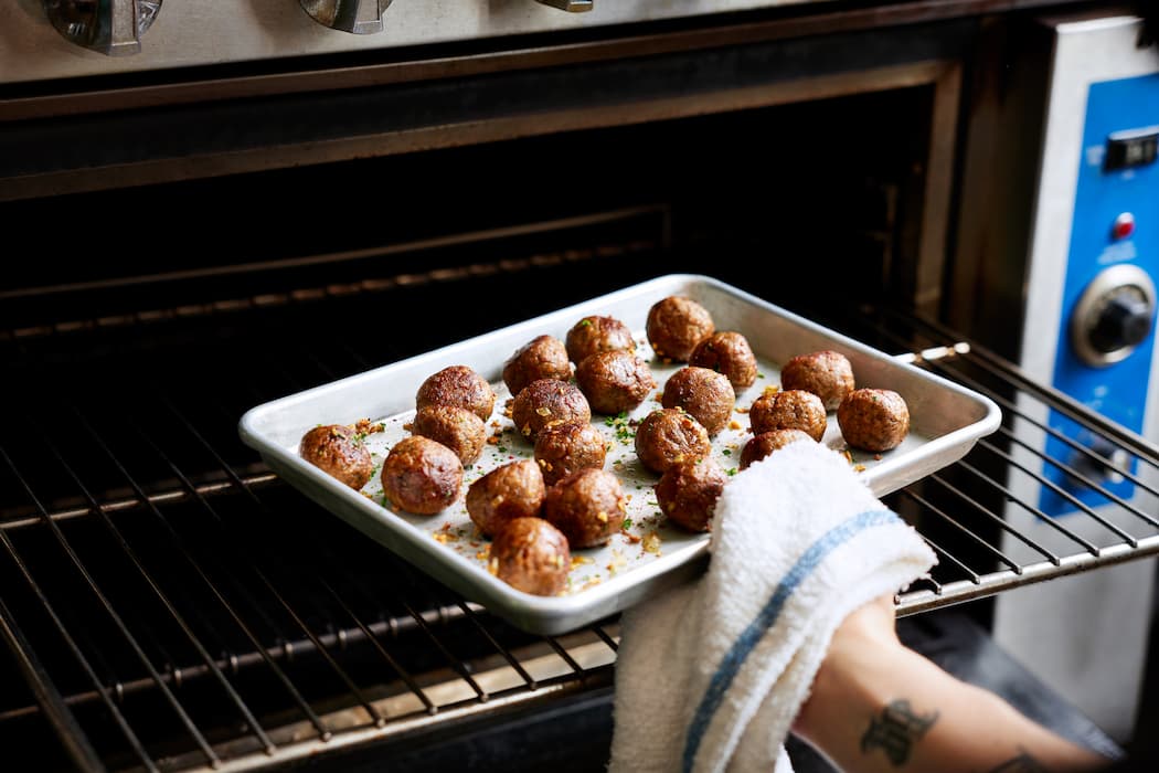 20 Comforting Impossible Meatball Dishes To Add To Your Men   2021 FS Meatballs Oven 0132 RT  1  