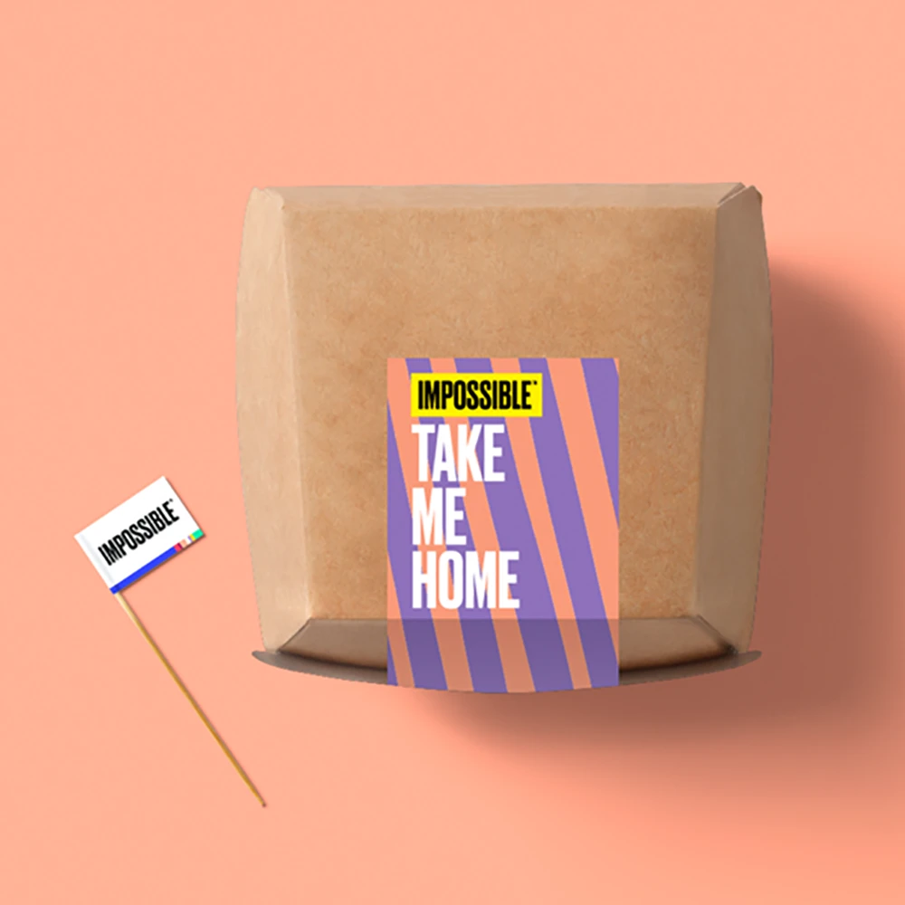 Food cardboard takeout box with a sticker on it that says take me home