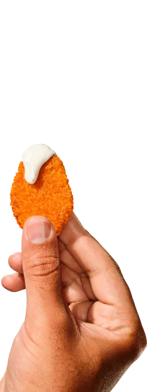 Chicken nugget in a hand