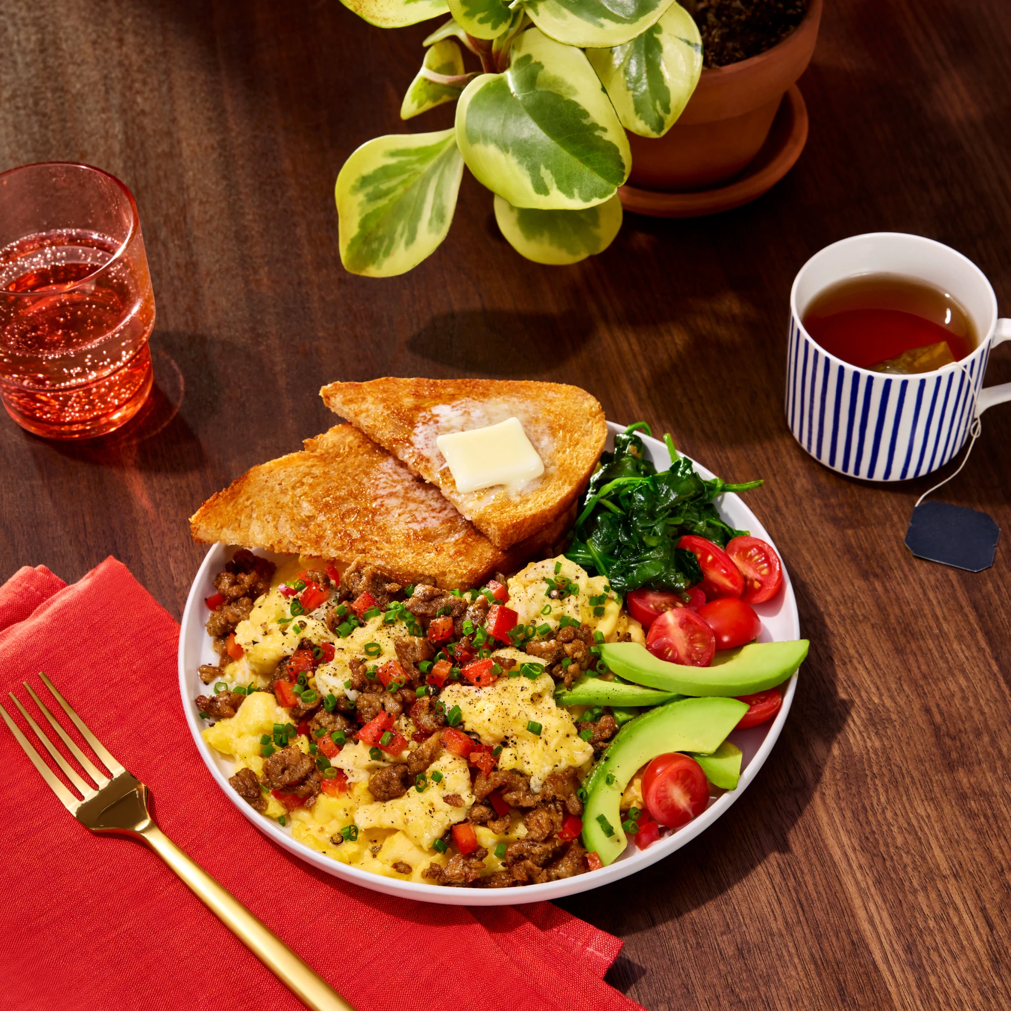 Breakfast plate featuring Impossible Ground Sausage with toast and eggs 