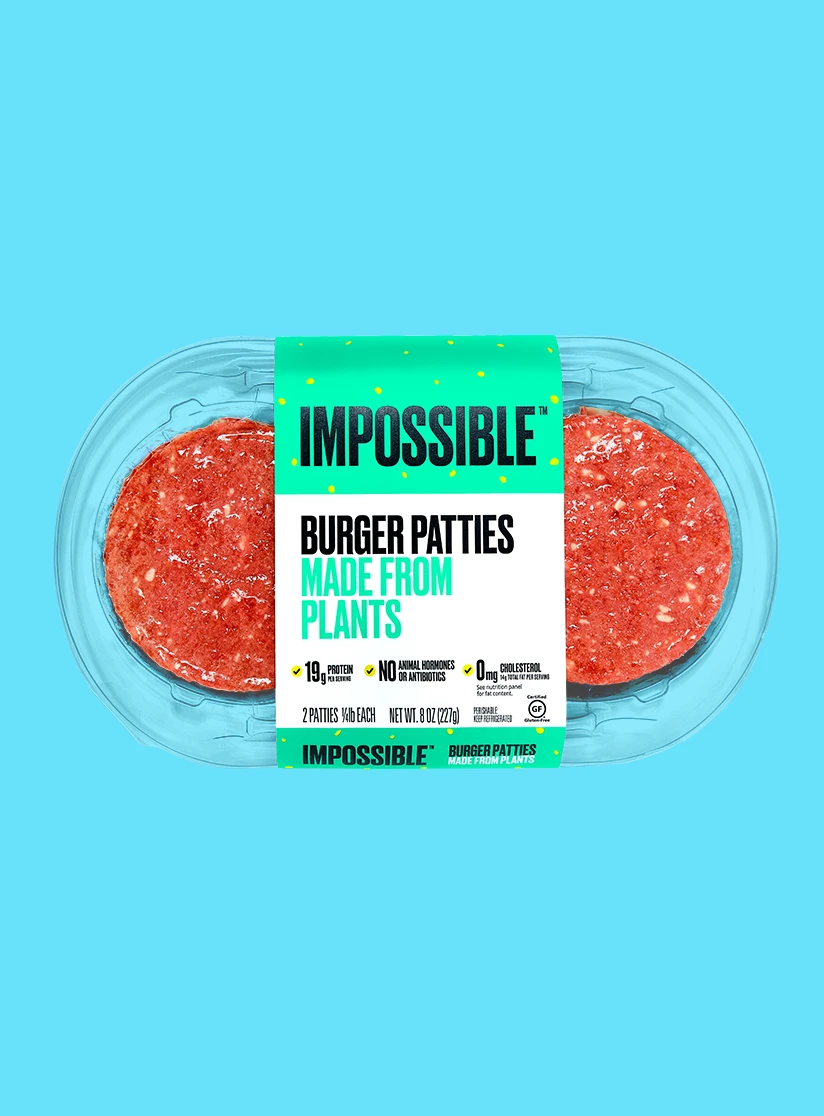 Impossible Burger patty 2 pack available in grocery stores on cyan background