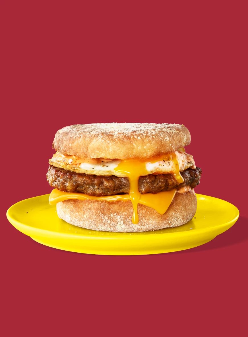 Impossible Sausage for foodservice showcased within a breakfast sandwich
