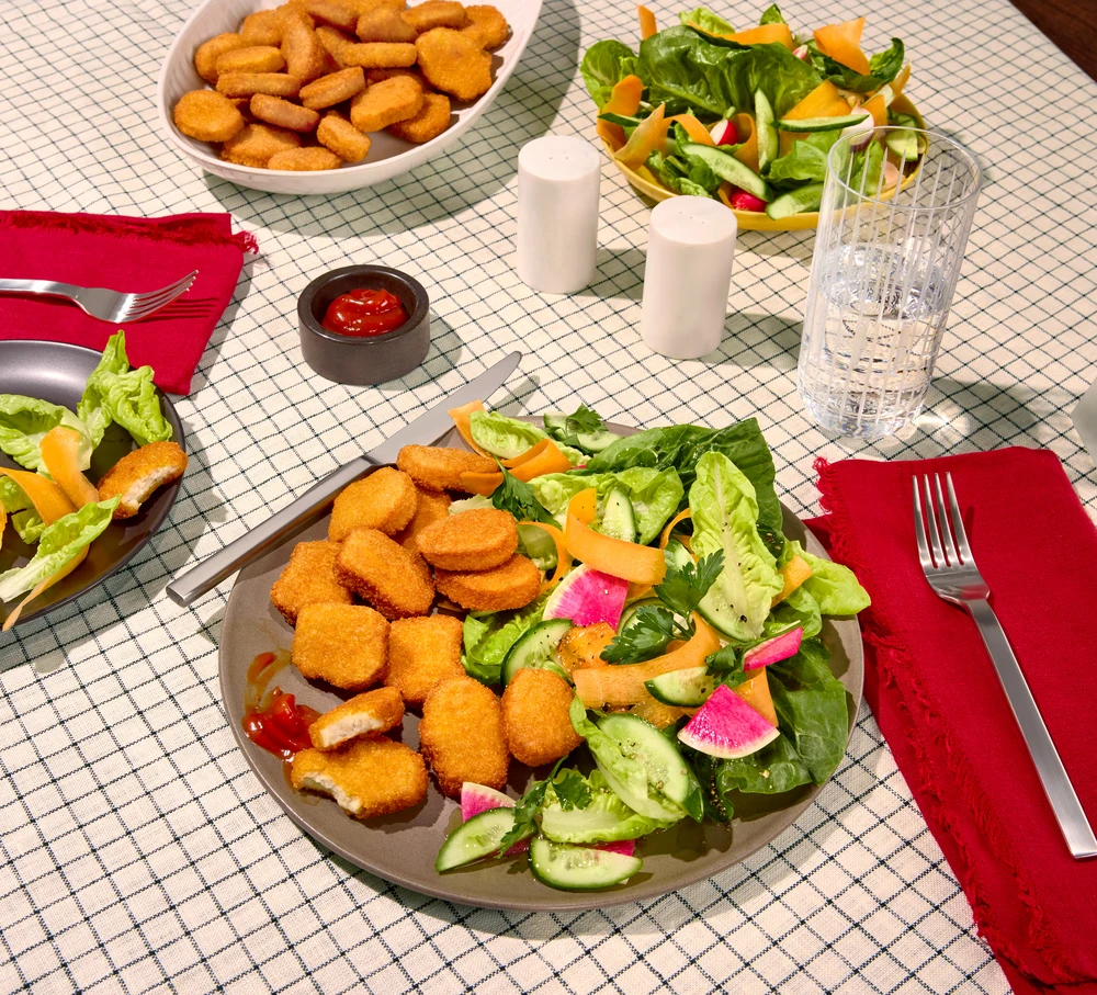 Impossible Chicken Nuggets plated with a side of salad