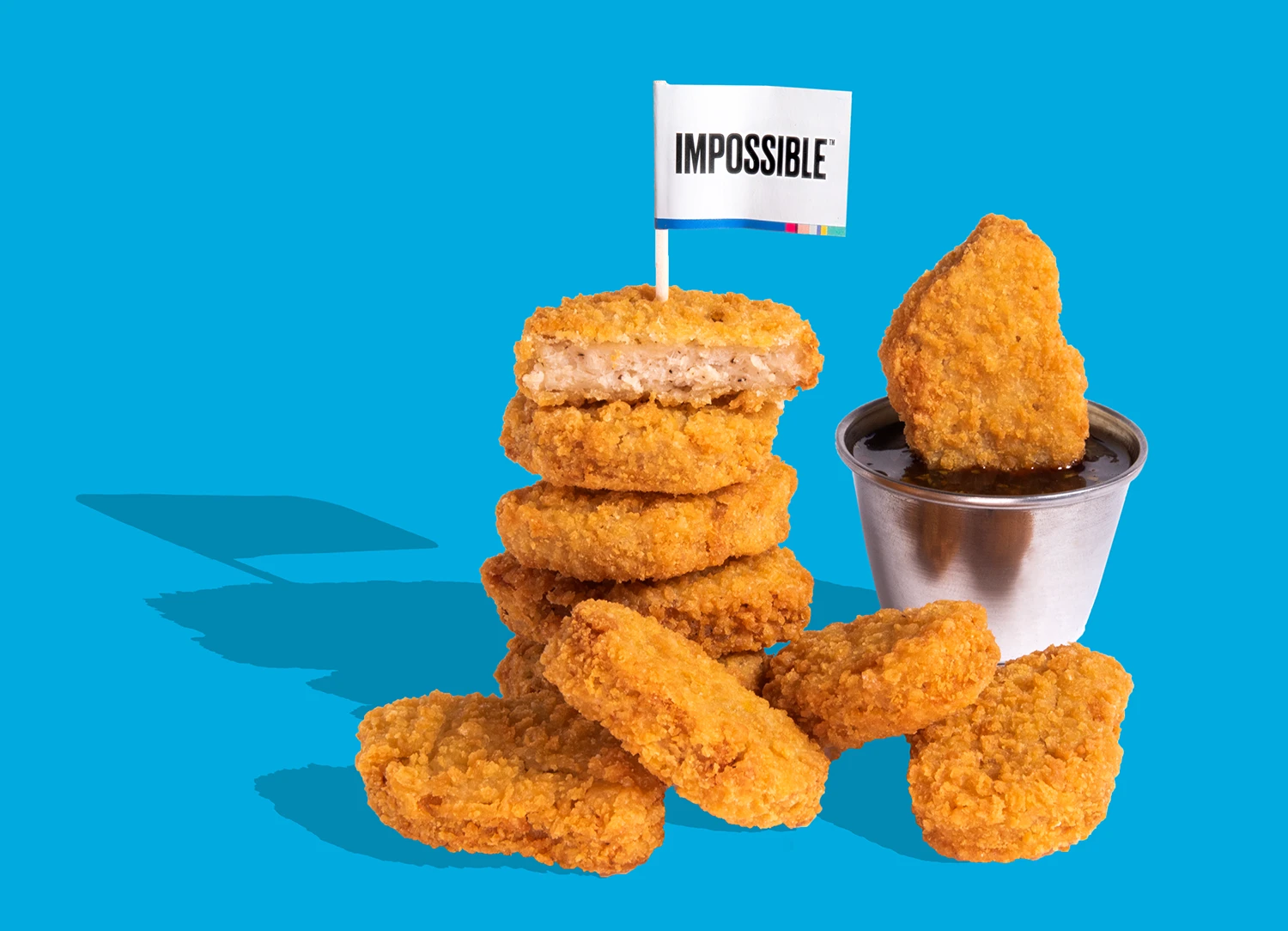 ImpossibleTM Chicken Nuggets Made From Plants with Sticky Sesame sauce over fries. No chickens were harmed in the making of this must-have dish! Sauce is on the side so you can smother it or dunk it with sauce - it’s your destiny!