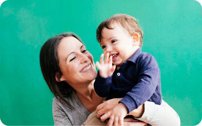 Woman and baby smiling