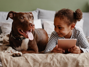 Girl smiling with a dog