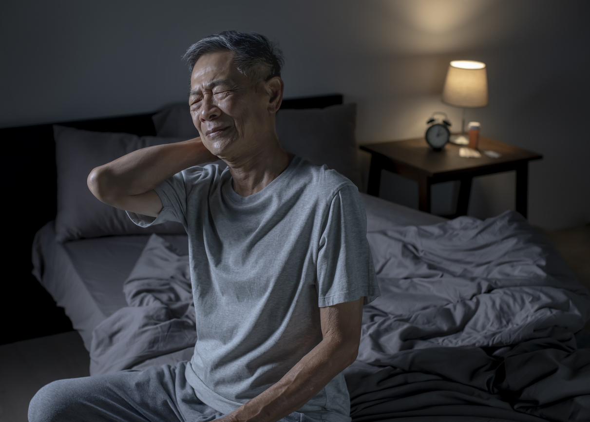 man-feeling-upper-back-pain-after-sleeping