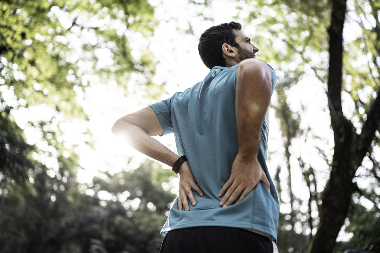 man-feeling-lower-back-pain-after-workout