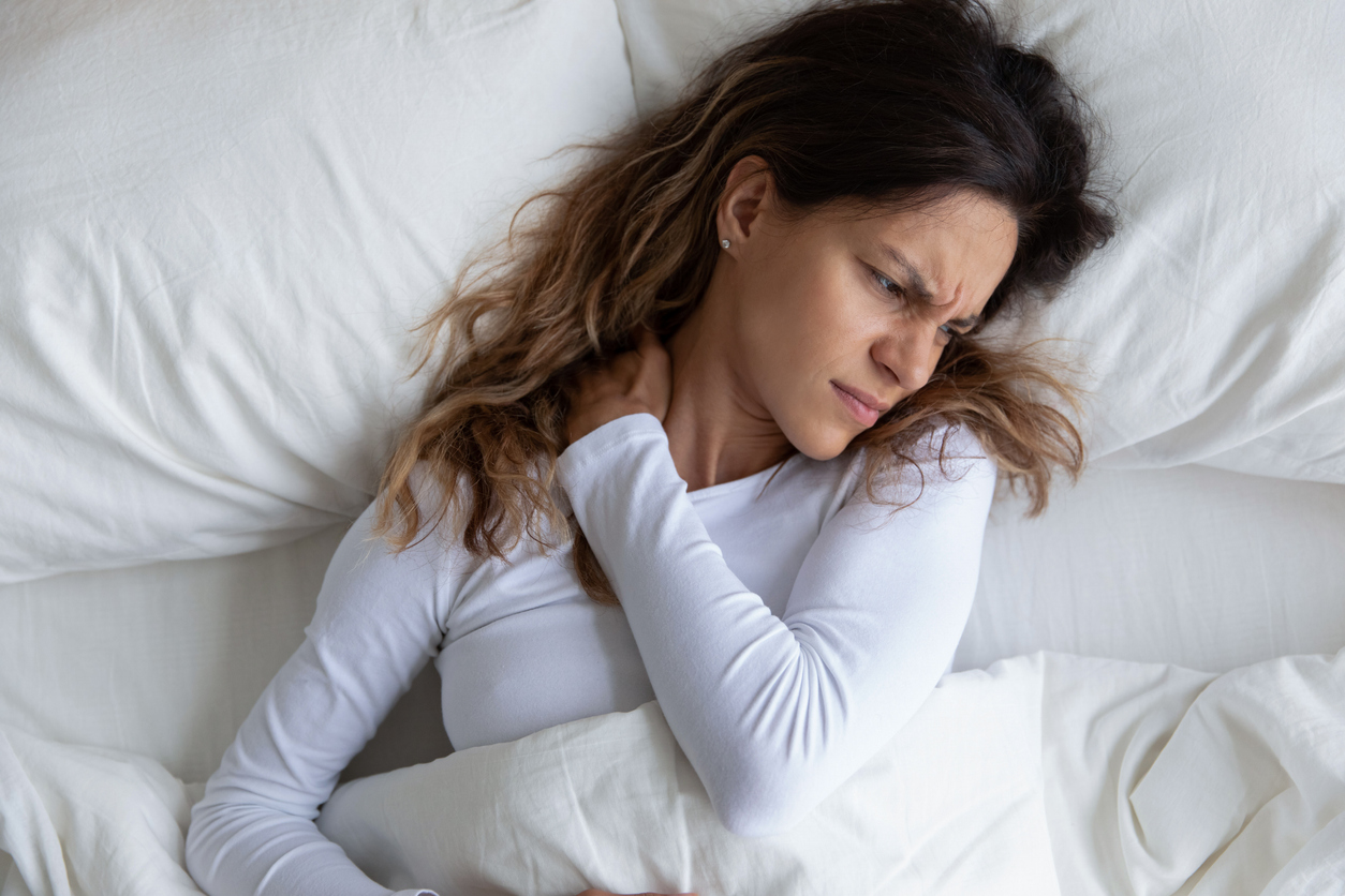 woman thinking how to sleep with cervical radiculopathy