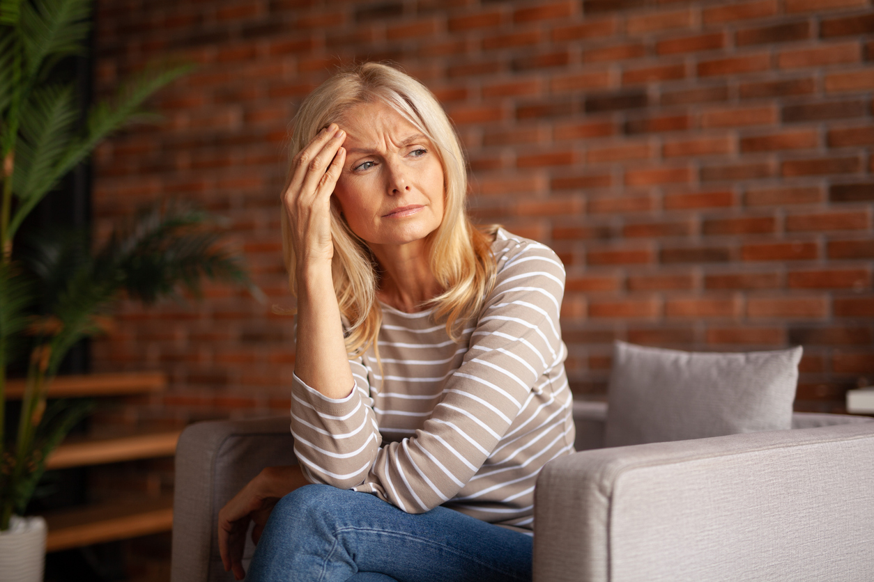 woman feeling menopause brain fog