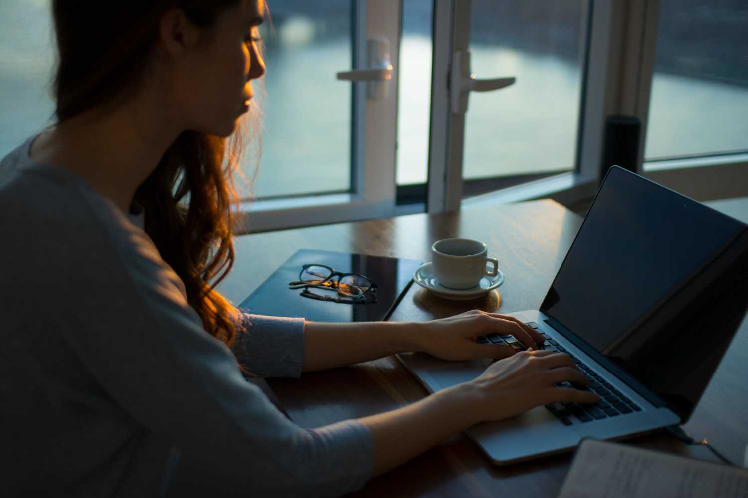 Person typing on laptop