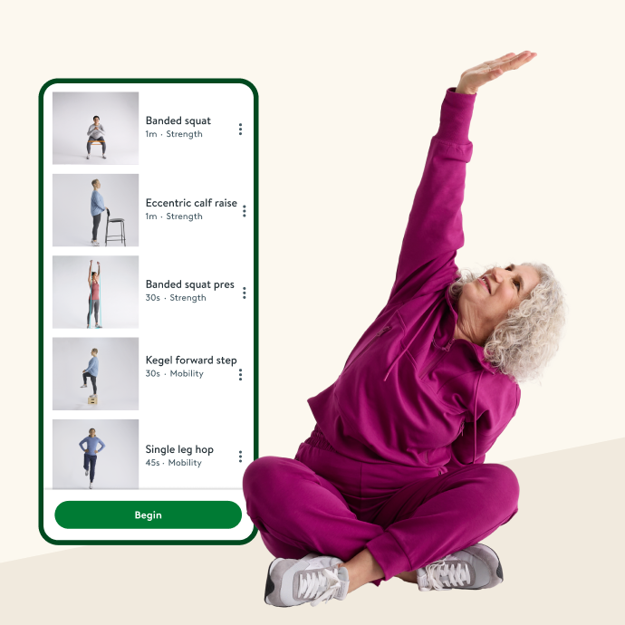 Woman sitting stretching one arm in the air, posed next to mobile app display of Hinge Health