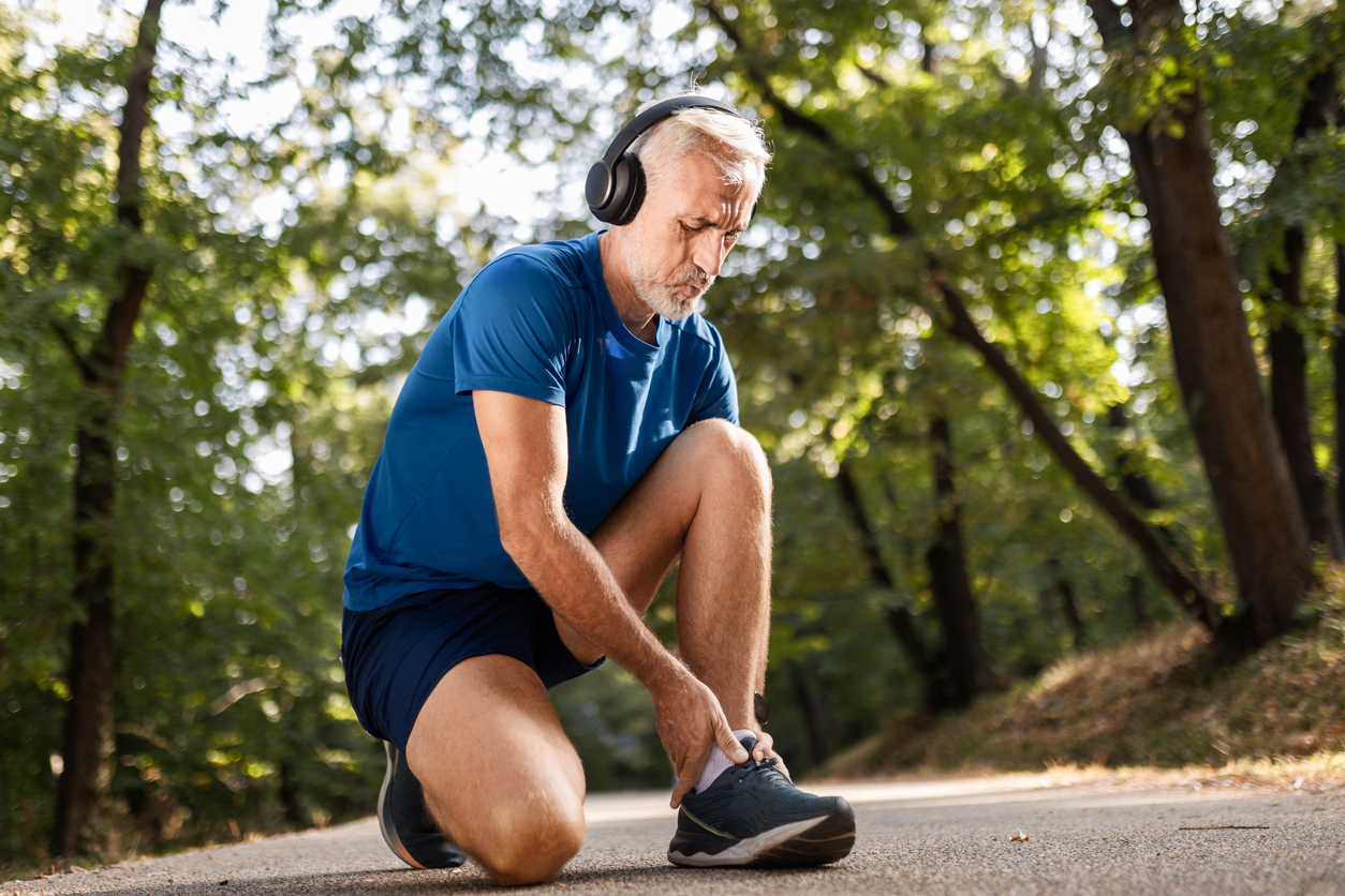 man feeling bone spur ankle