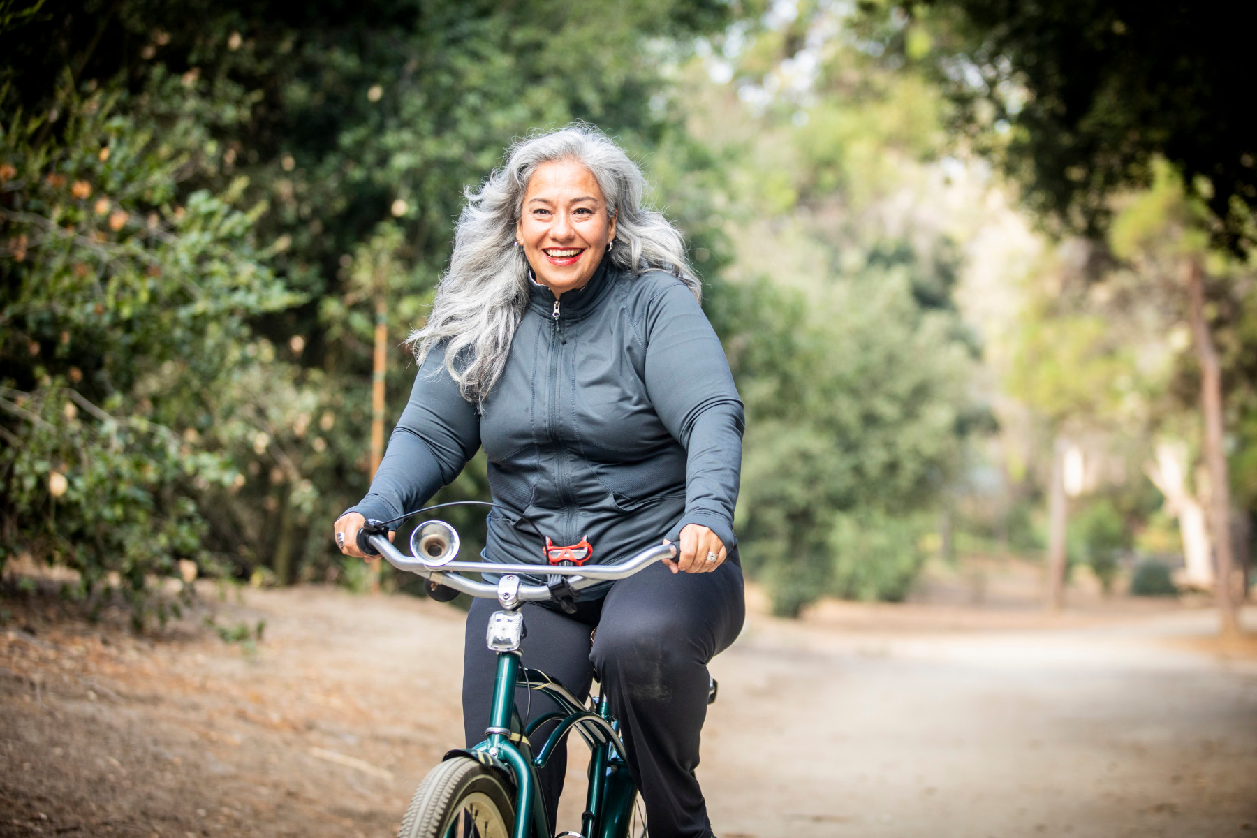 Woman riding a bike.