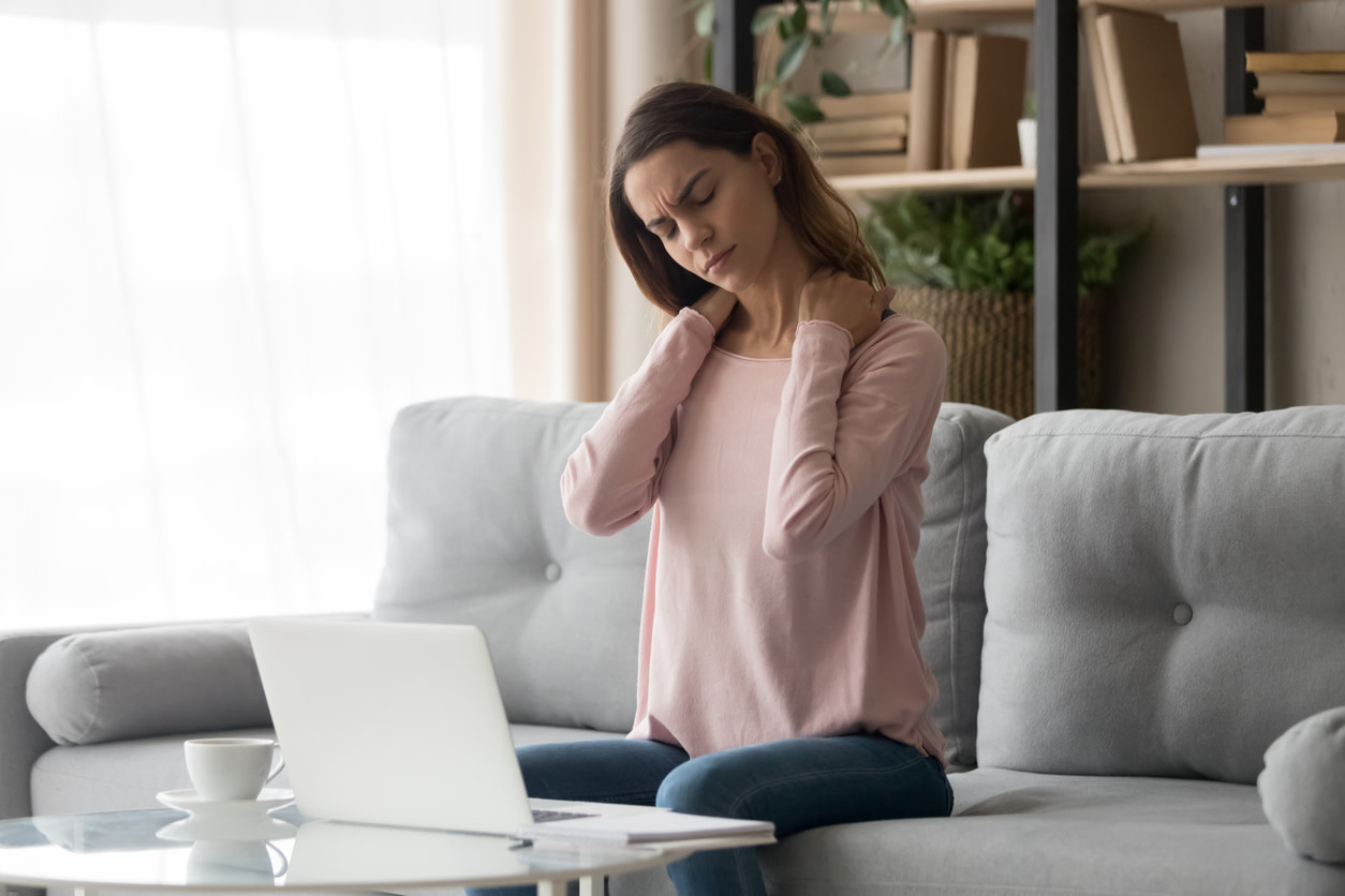 woman feeling stiff neck