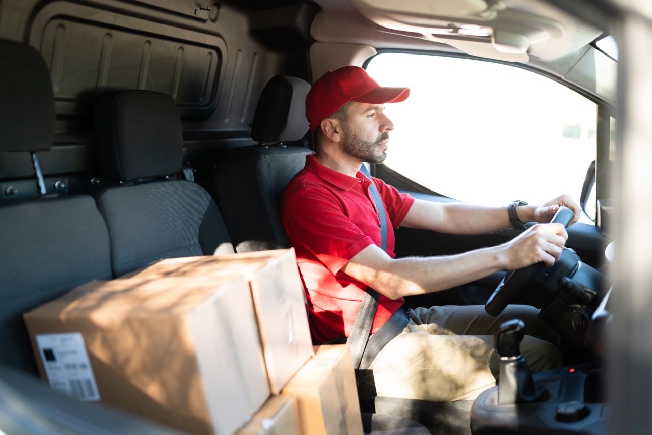 employee-driving-with-boxes-around