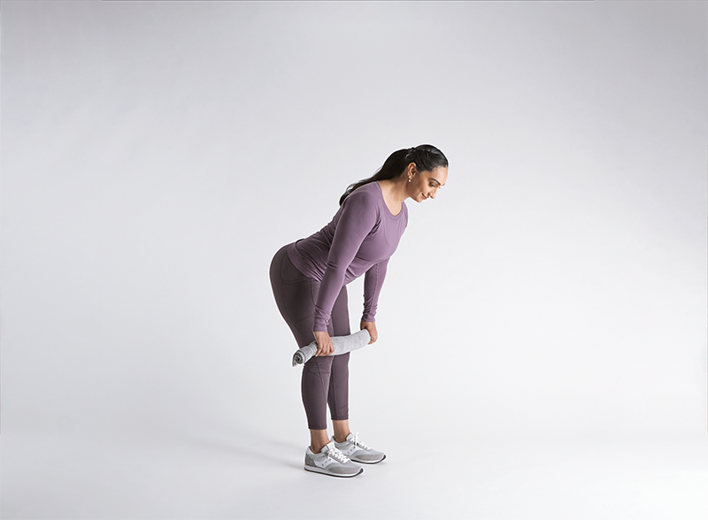 Person in purple athletic wear performing diastasis recti exercises against a white background