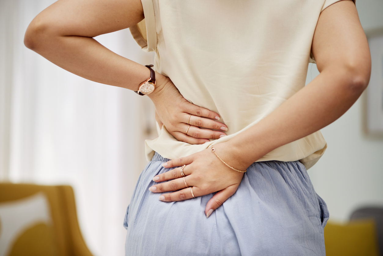 lower back pain left side above buttocks