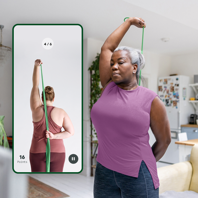 Woman doing arm exercise with resistance bands