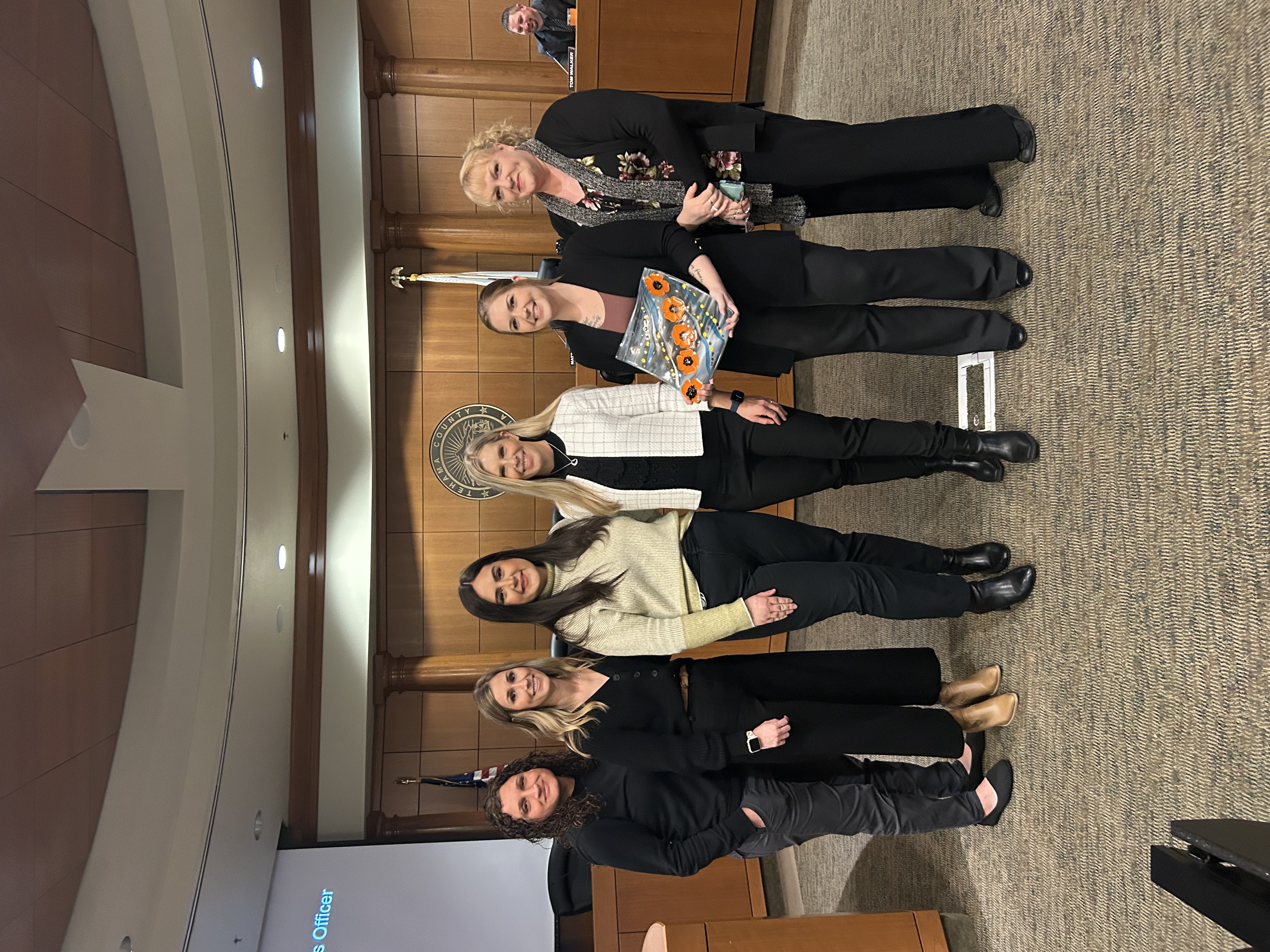PRISM employees accepting an award together