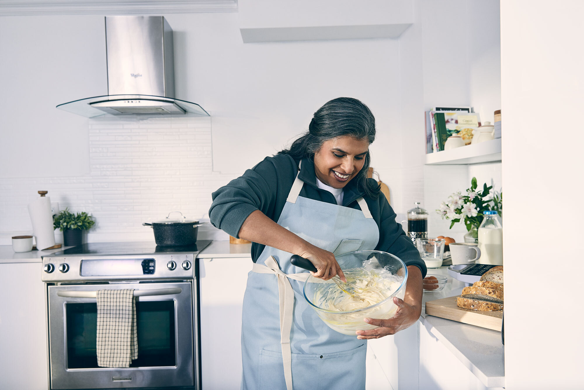 older-woman-Cooking-happily-at-kitchen