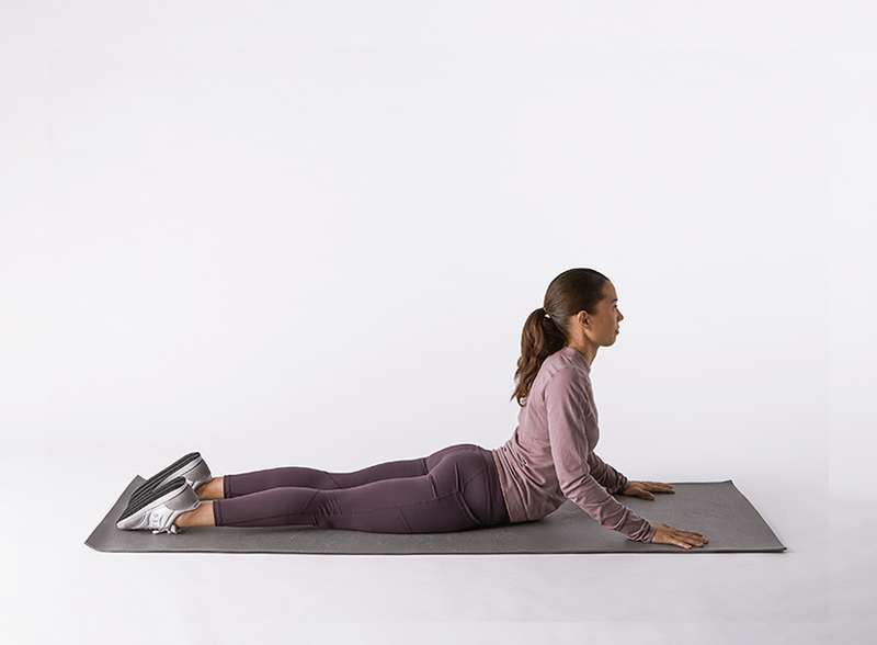 End your workout with Cobra Stretch pose. Since Cobra pose is a backbend,  it stretches the entire front of the body, from the chest and lungs, to  the