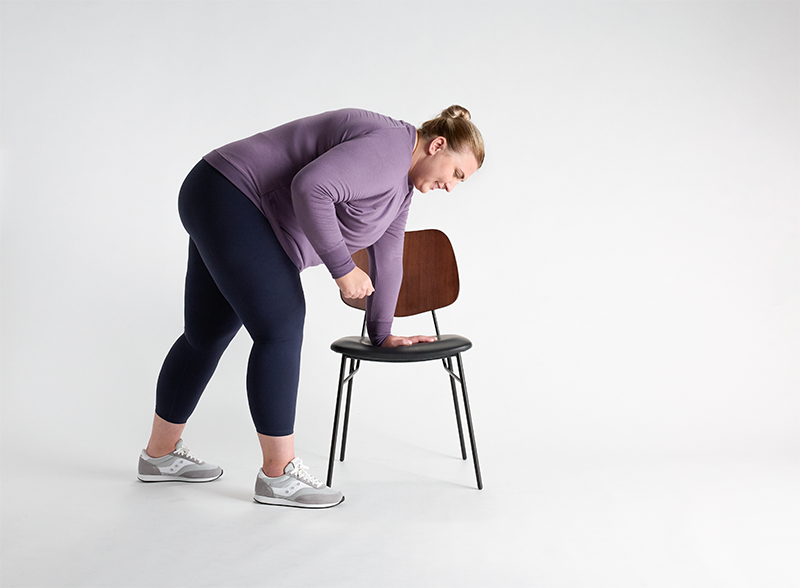 woman-doing-tricep-extension-with-chair