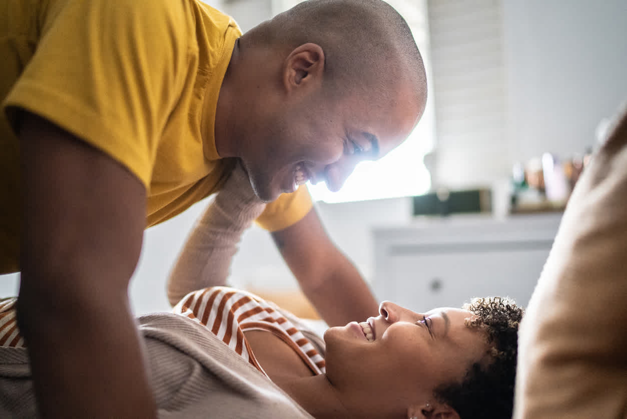 happy-couple-lying-in-bed