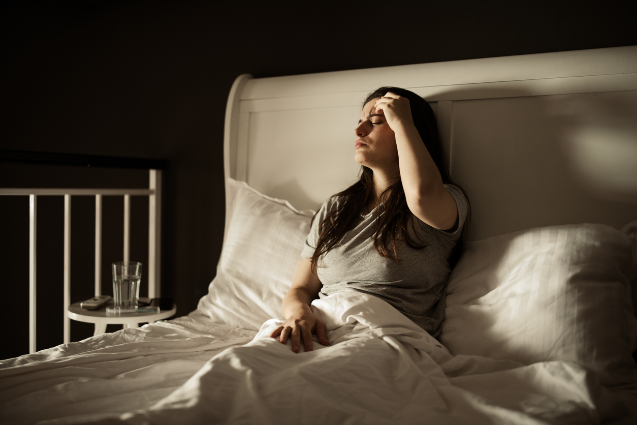 woman feeling postpartum night sweats