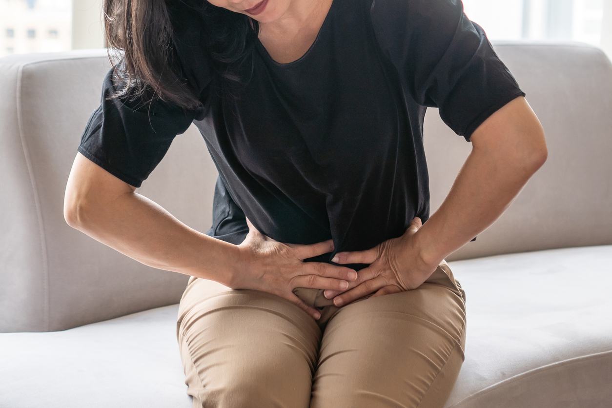 woman feeling groin pain