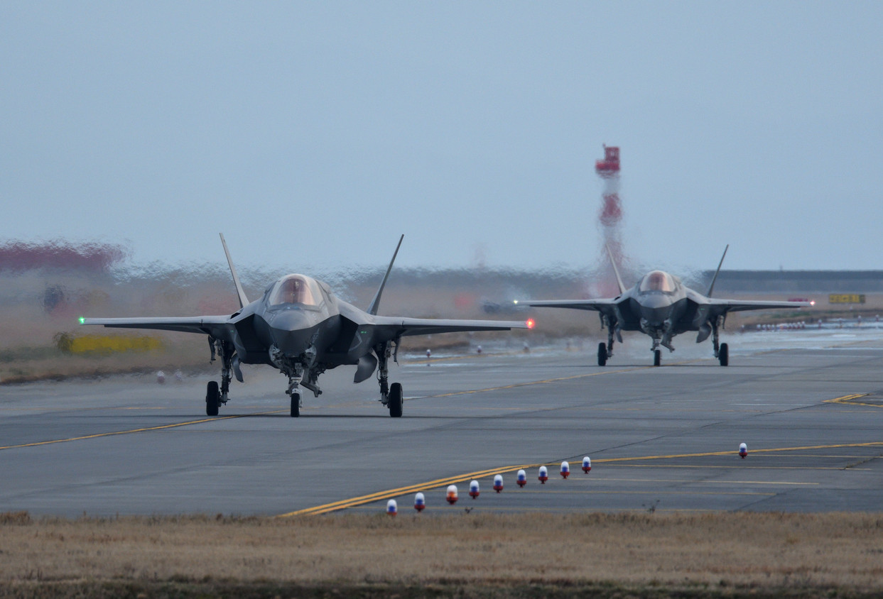 Two fighter jets on a runway