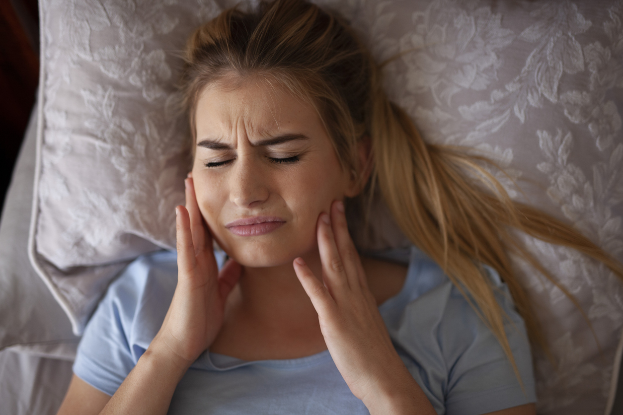 woman-feeling-tmj-pain