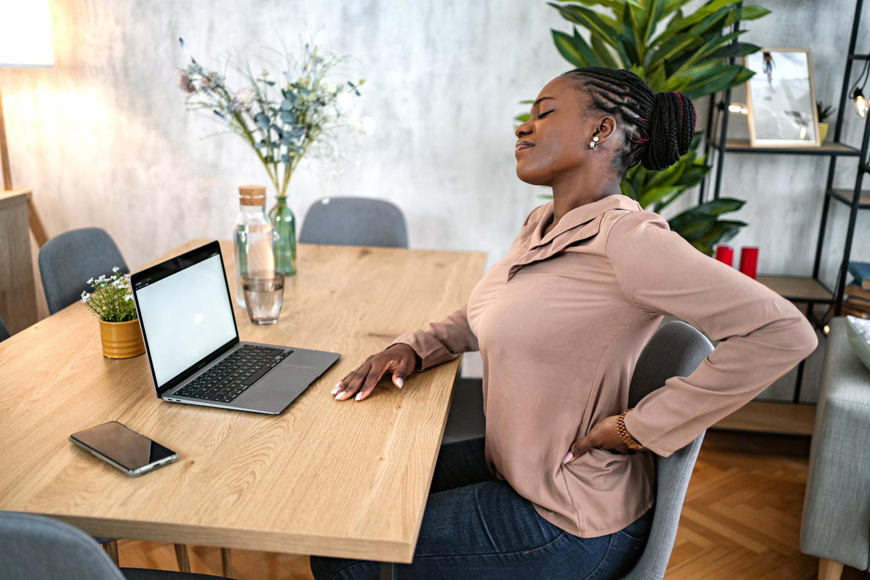 woman-working-grabbing-her-back
