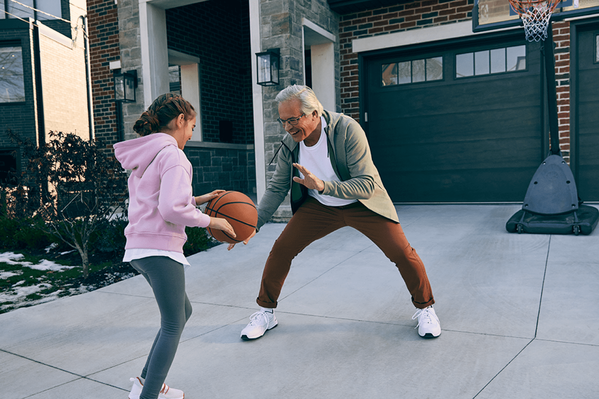 Older-man-playing-basketball-with-younger-family-member-fall-prevention-for-older-adults