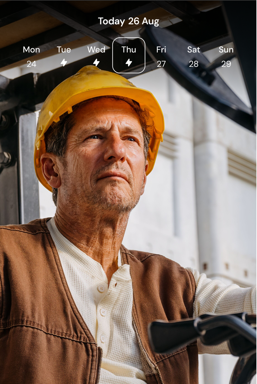An older man on a construction site is wearing a hard hat and a work vest. An app screen shows the option to chat with members of his care team: either a physical therapist or health coach.