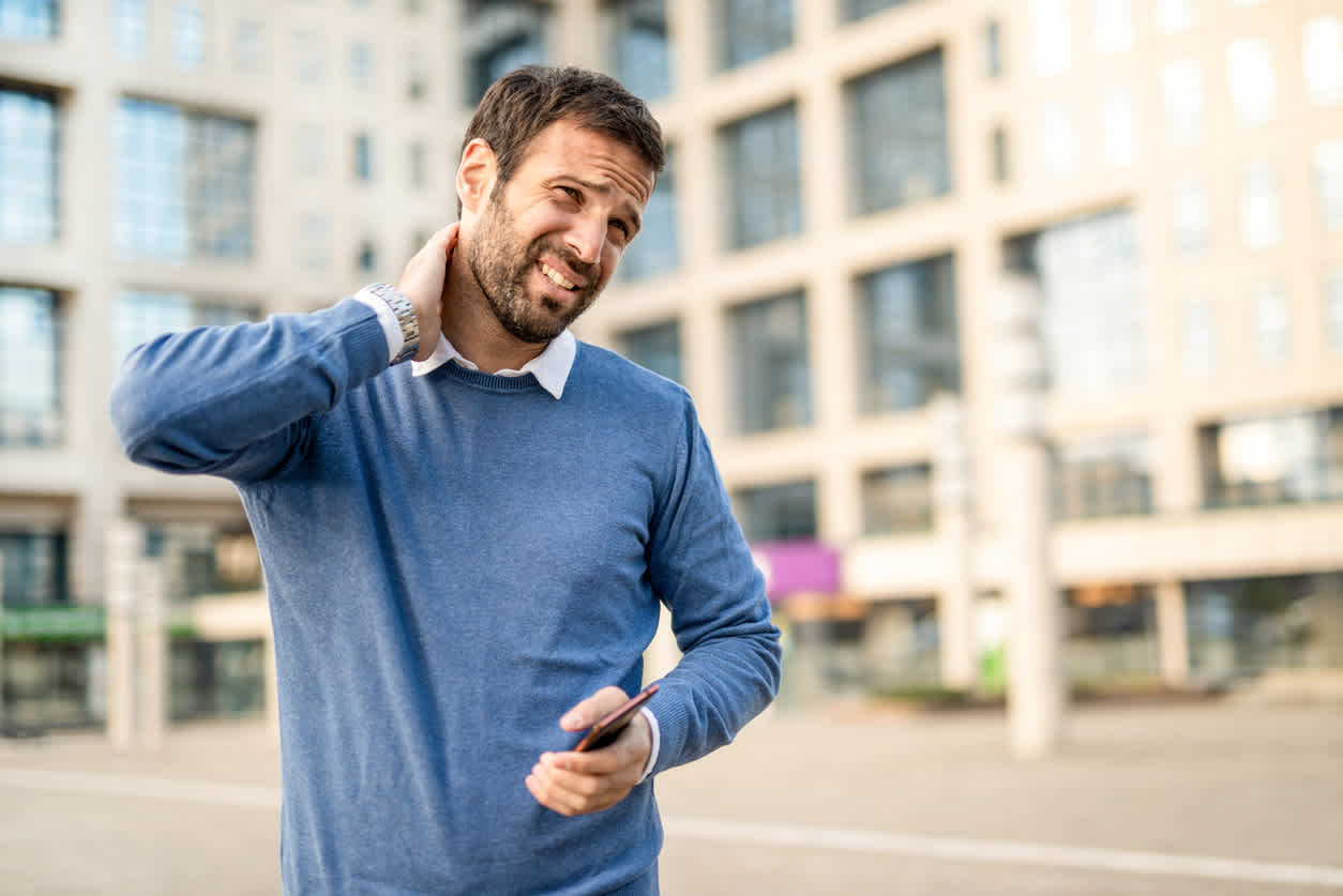 man-in-the-street-with-neck-pain