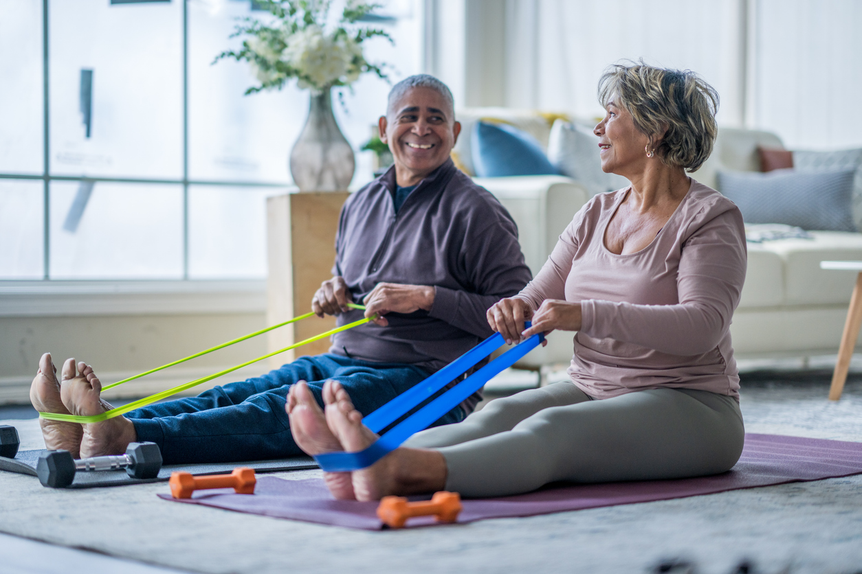 senior-couple-exercising-in-their-living-room