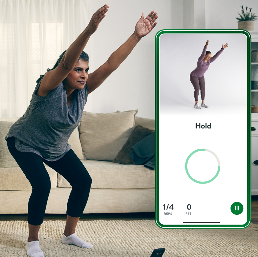Lady doing exercises with the Hinge Health app showing a chair pose 